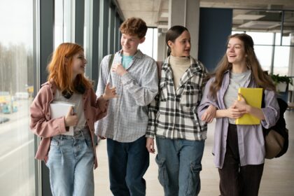 Happy high school students in the classroom