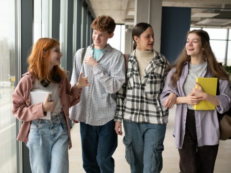 Happy high school students in the classroom