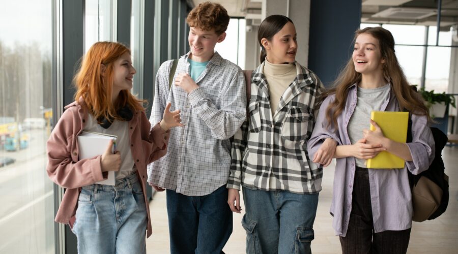 Happy high school students in the classroom