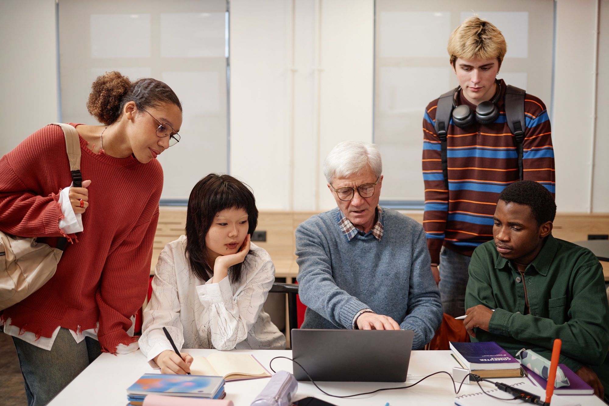 Senior College Professor with Group of Students During Class