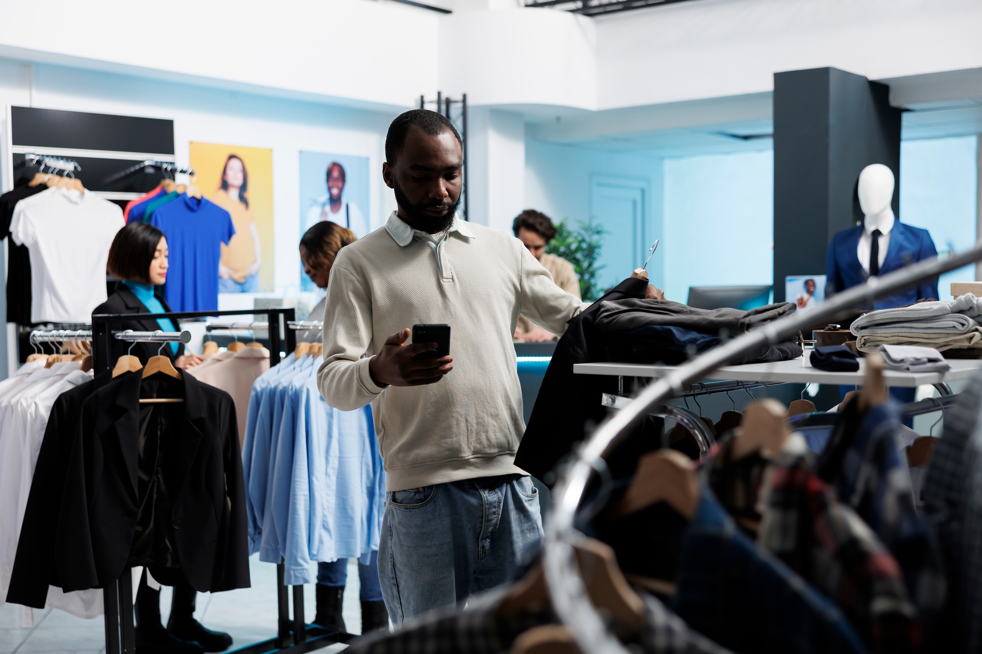 Man shopping and checking size on phone