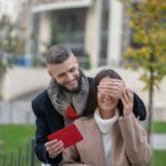 Nice positive man holding a letter for his girlfriend