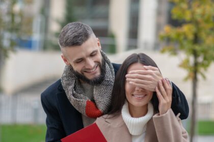 Nice positive man holding a letter for his girlfriend
