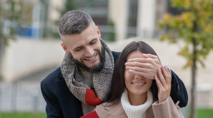 Nice positive man holding a letter for his girlfriend