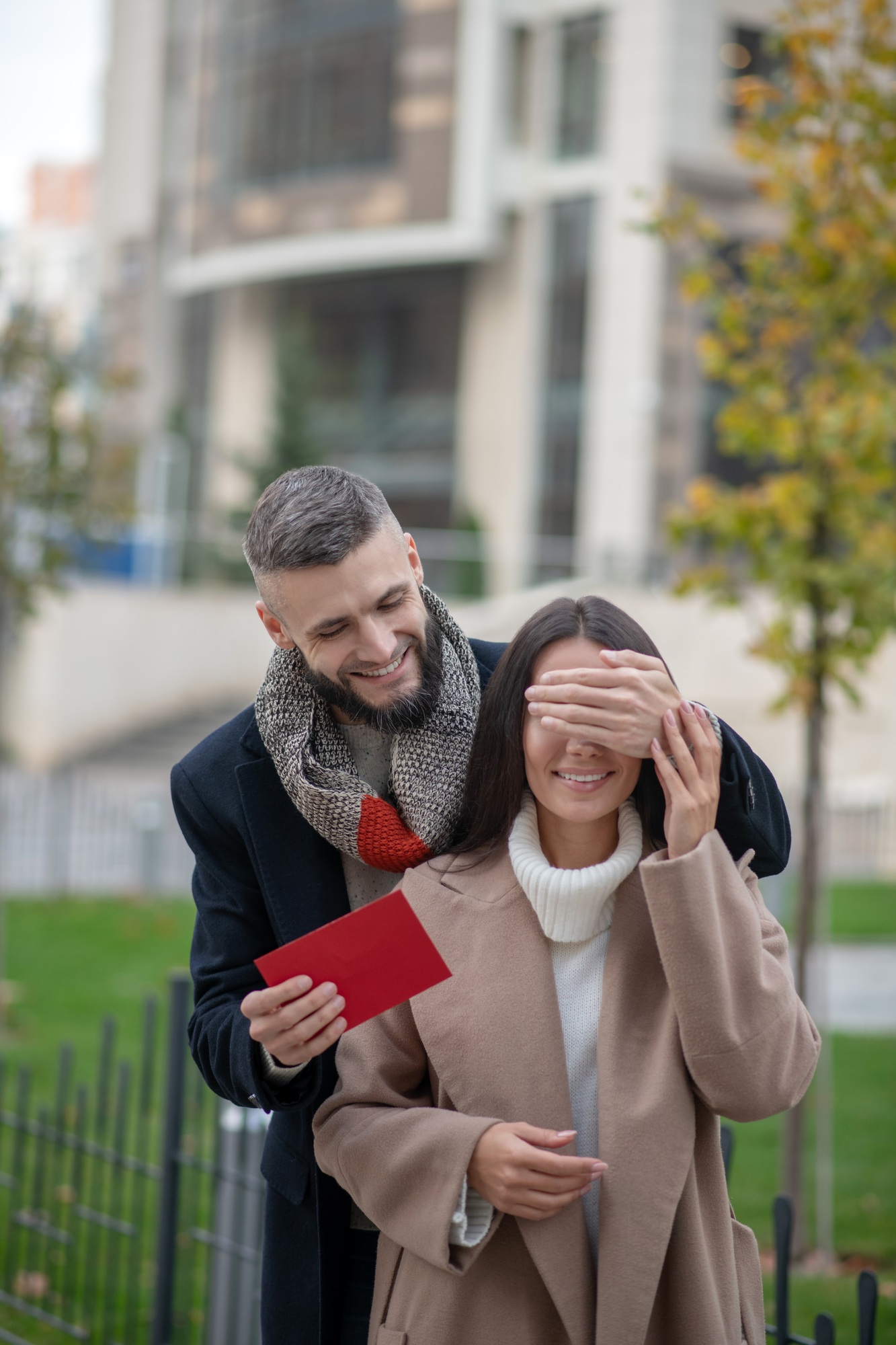 Nice positive man holding a letter for his girlfriend